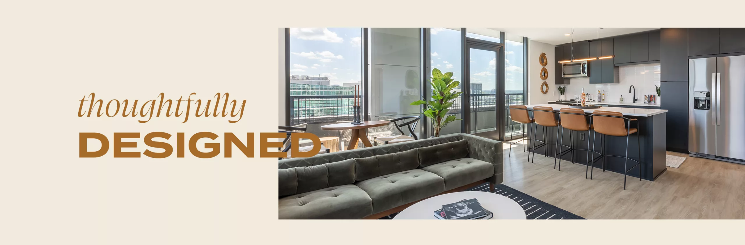 Photo of a living room in a high-rise apartment with the words "Thoughtfully Designed" layered overtop.